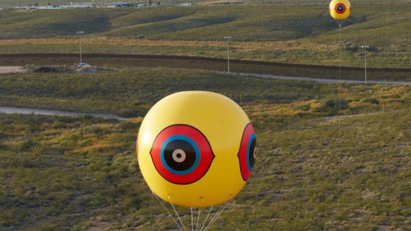 Close-up of a \"scare-eye\" balloon used in the Repellent Fence installation. / Photo courtesy Postcommodity.