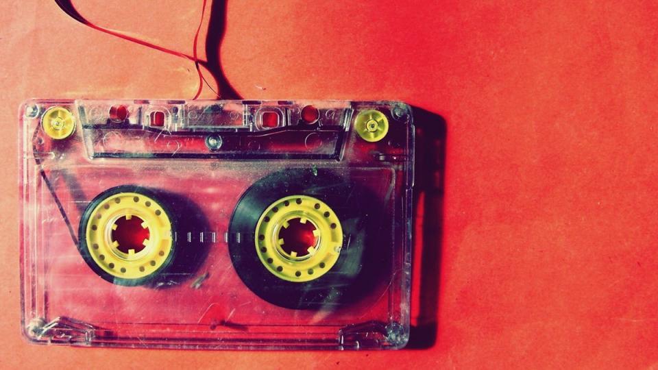 Image of a red and yellow cassette tape from pxhere