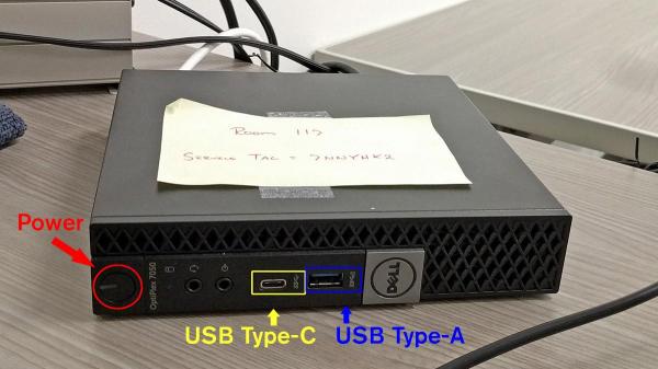 The room mini computer showing the USB ports and power button