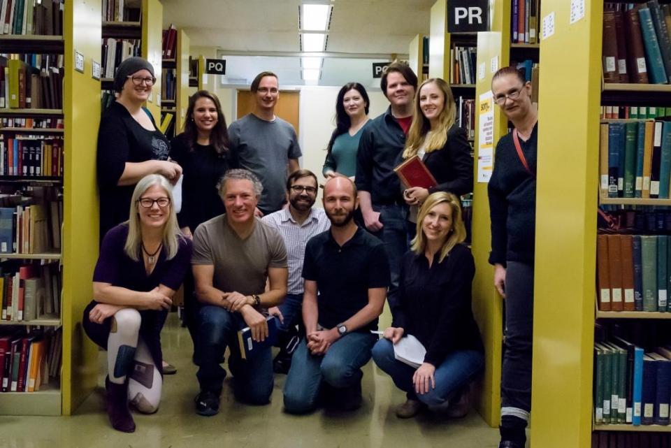 A group of Book Traces volunteers poses within the Hayden stacks./ Photo by Andy DeLisle/ASU