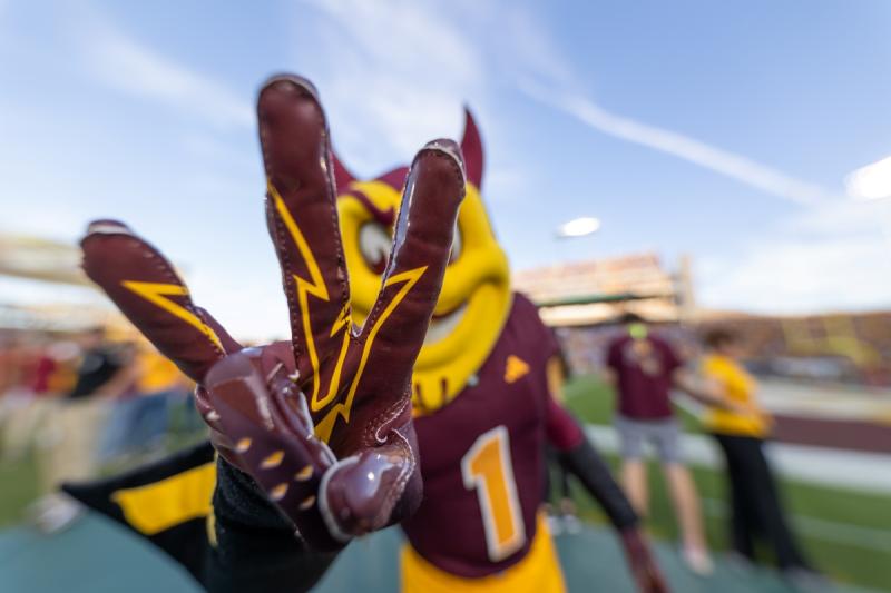 Sparky the Sun Devil makes the pitchfork salute at the camera.